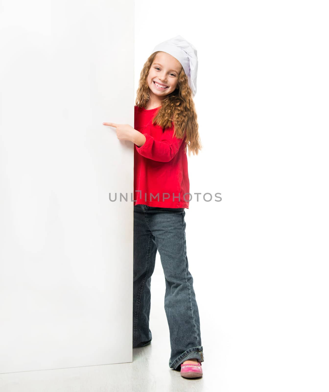 little smiling girl in chef hat with a white board