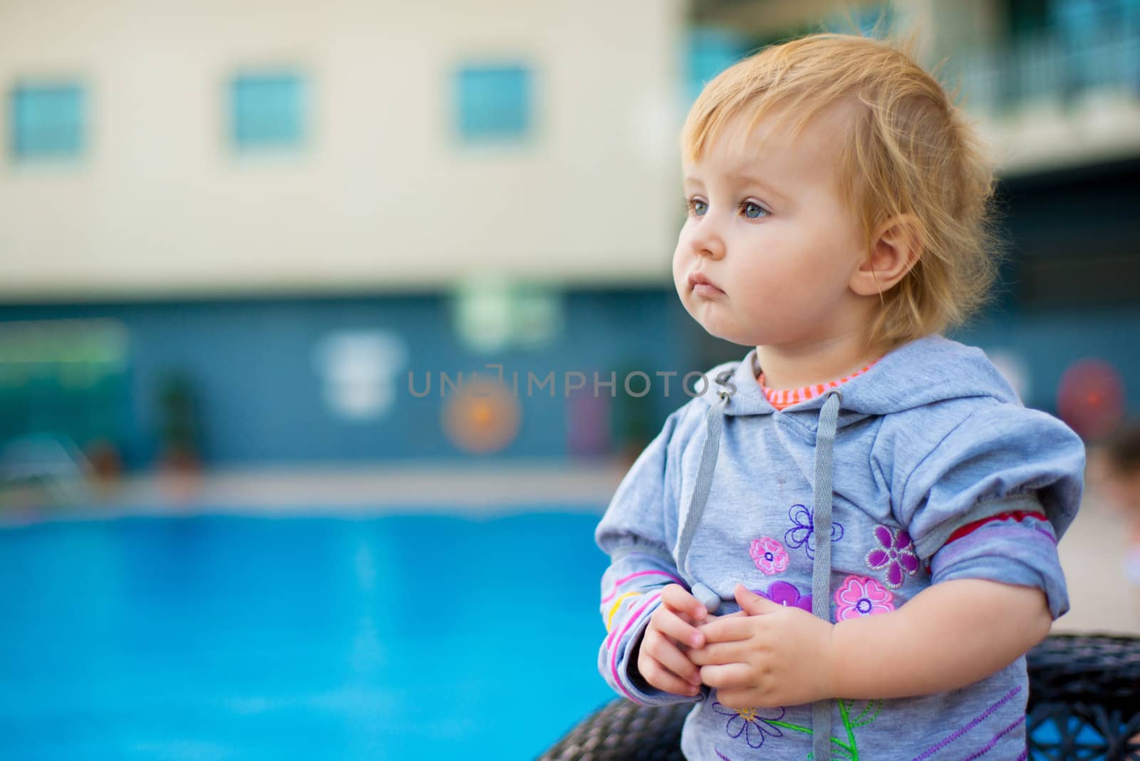 little cute baby near the pool