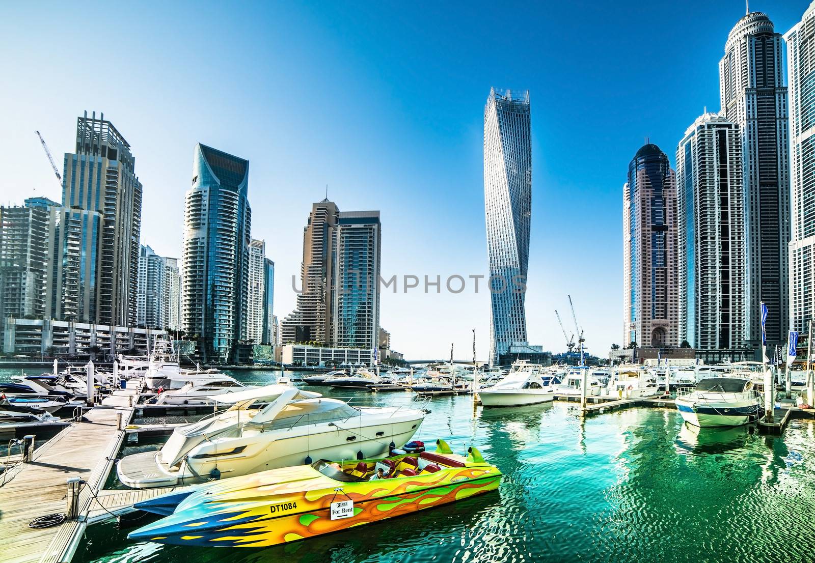 DUBAI, UAE - DECEMBER 14: Modern buildings in Dubai Marina, on december 14, 2013, Dubai, UAE. In the city of artificial channel length of 3 kilometers along the Persian Gulf.