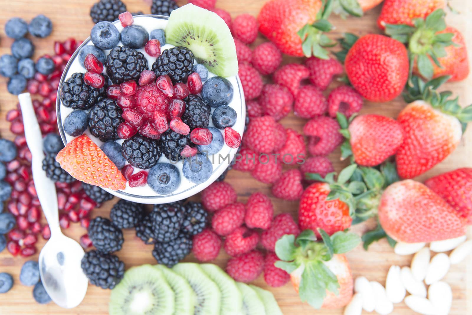 Healthy nutritious fresh fruits on a wooden table by coskun