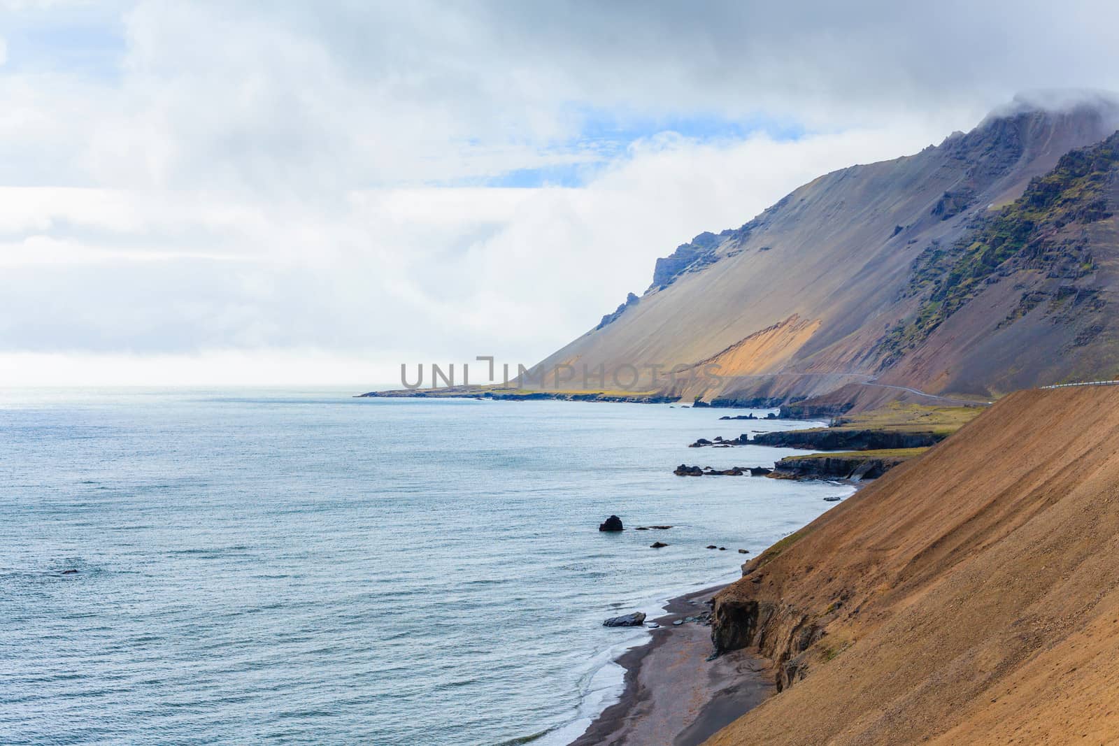 Cloudy sky over the coast in the East Fjords Iceland.