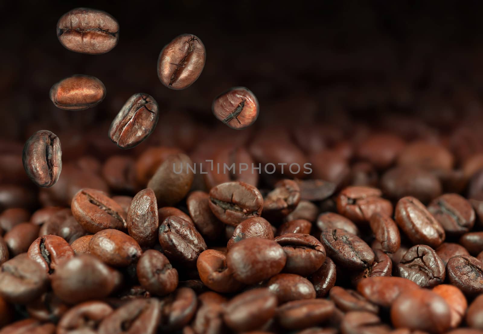 Falling coffee beans as a background with copy space
