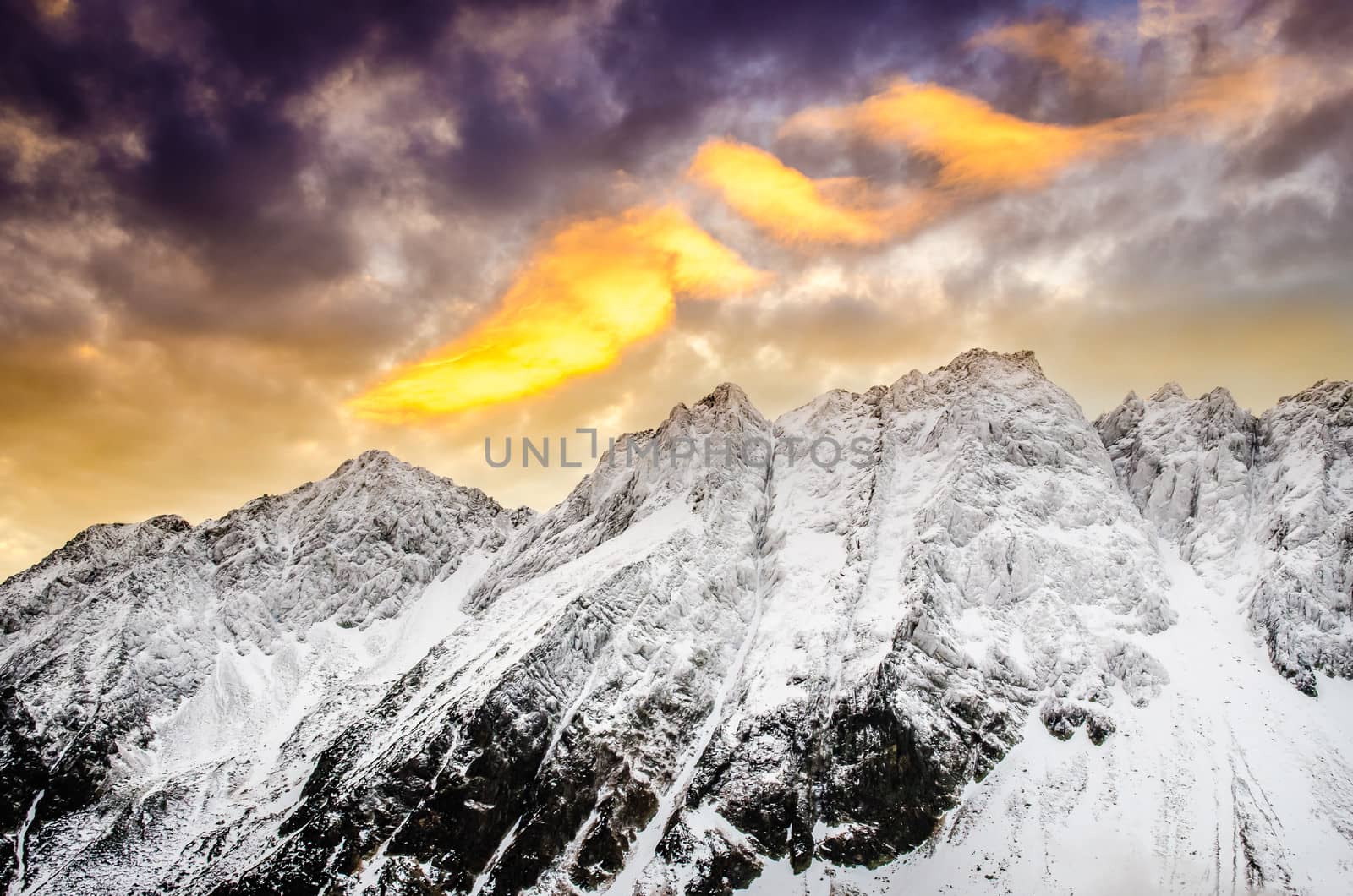 Winter mountains with dramatic colorful sky at sunset, High Tatras, Slovakia