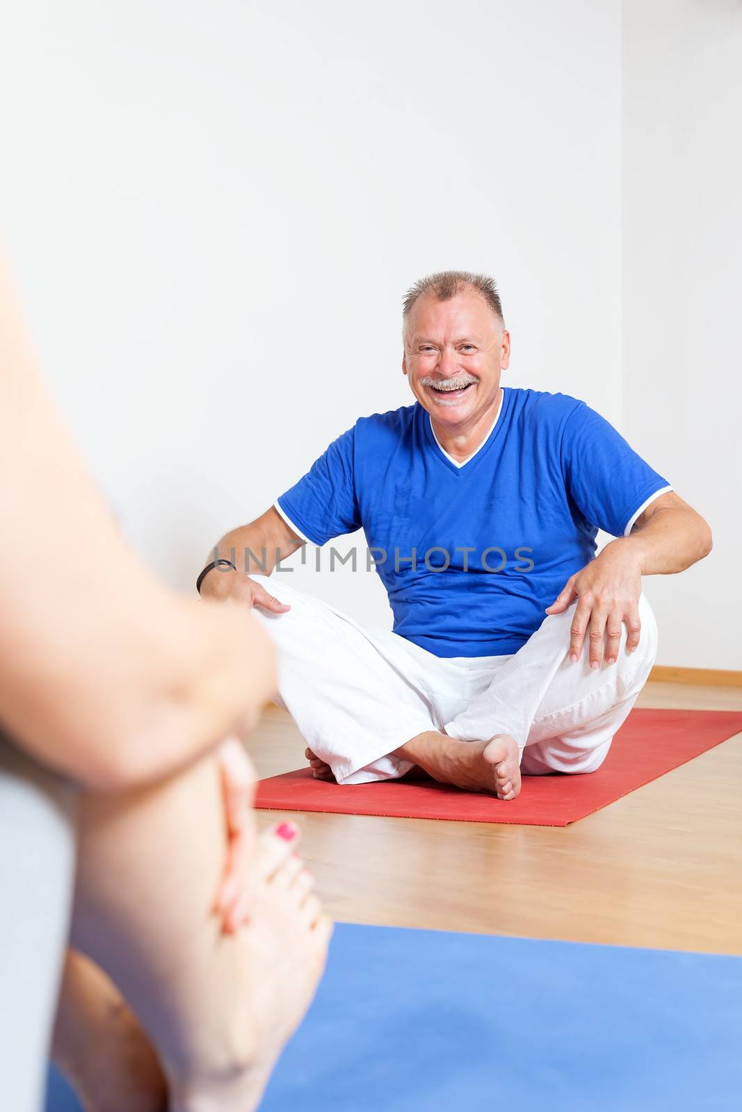 An image of a man doing yoga exercises