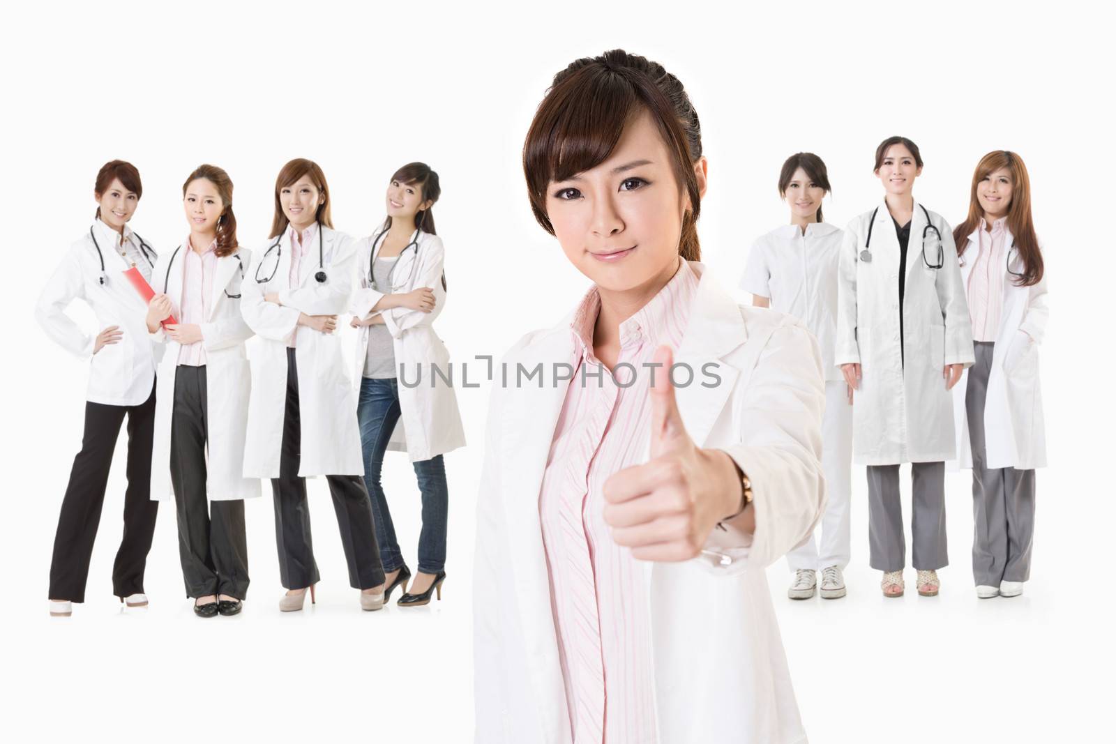 Asian doctor woman stand in front of her team and give you an excellent sign, closeup portrait on white background.