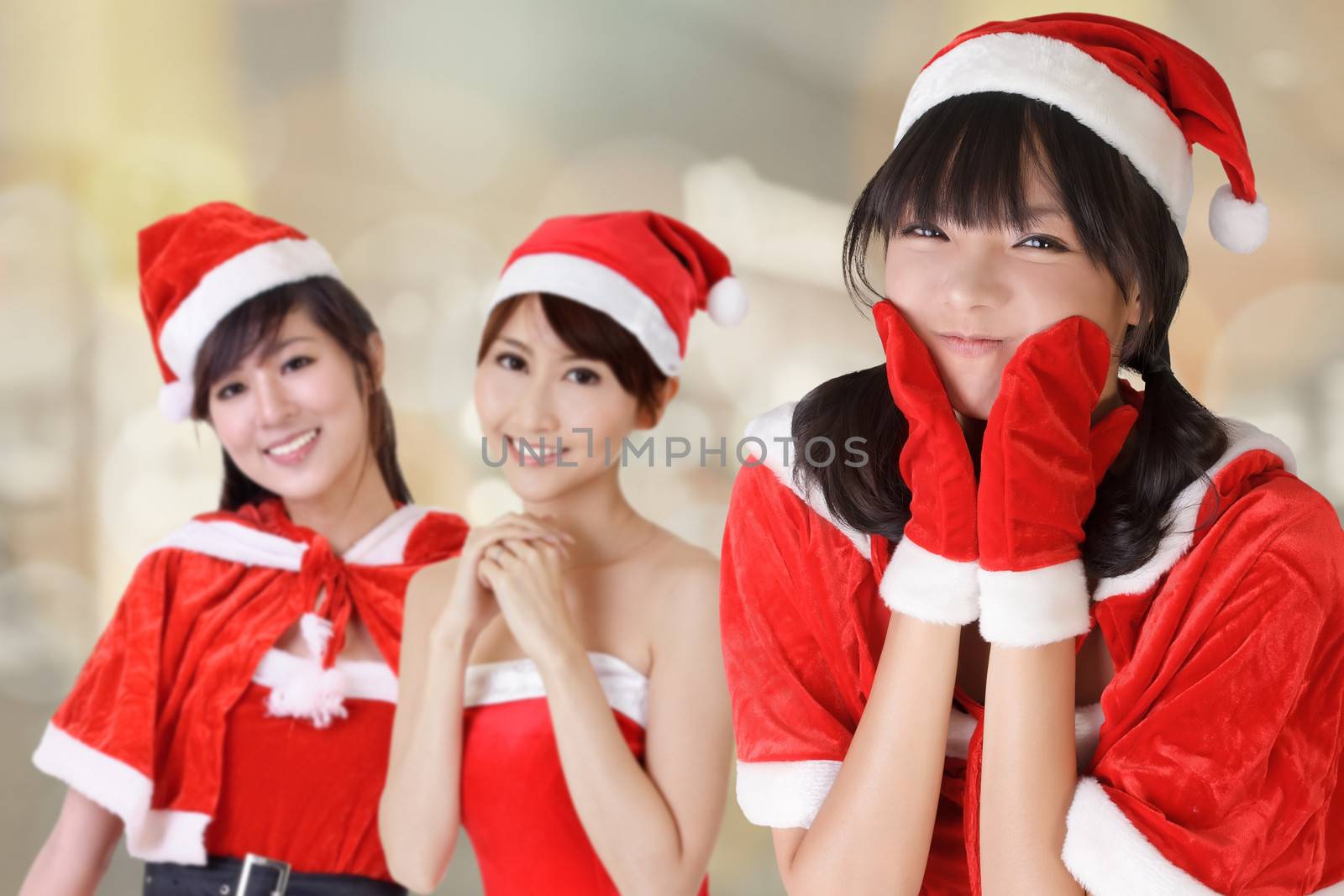 Happy smiling Asian Christmas girls, closeup portrait of three young women.