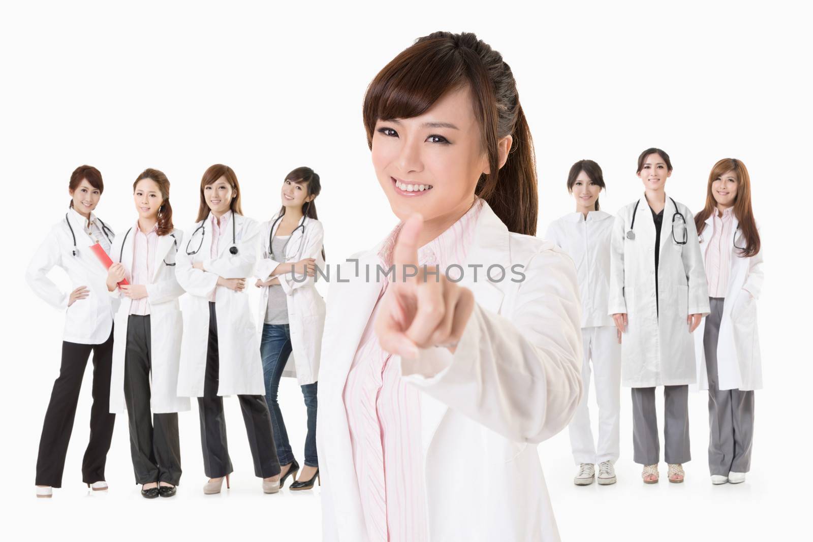 Asian doctor woman stand in front of her team and point at you, closeup portrait on white background.
