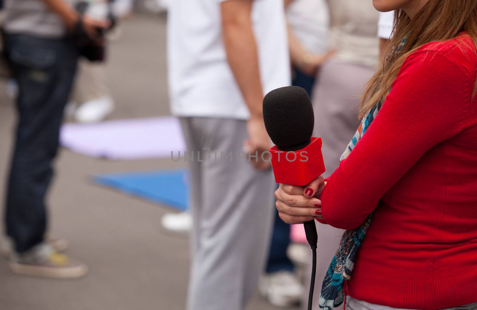 TV or radio reporter waiting for an interview.