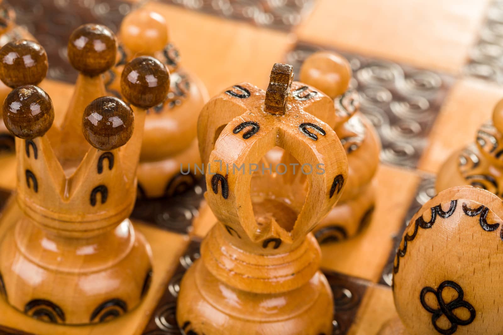 closeup chess board focus to white king and queen on white background