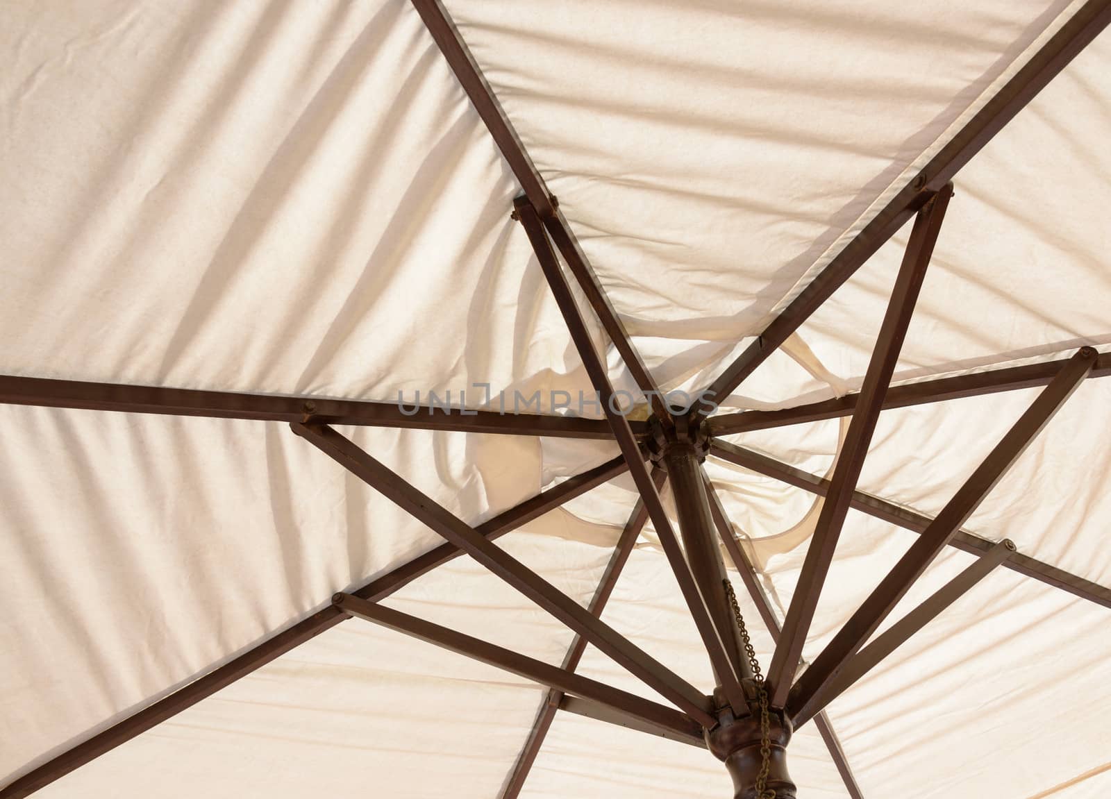 Off-white parasol seen from underneath