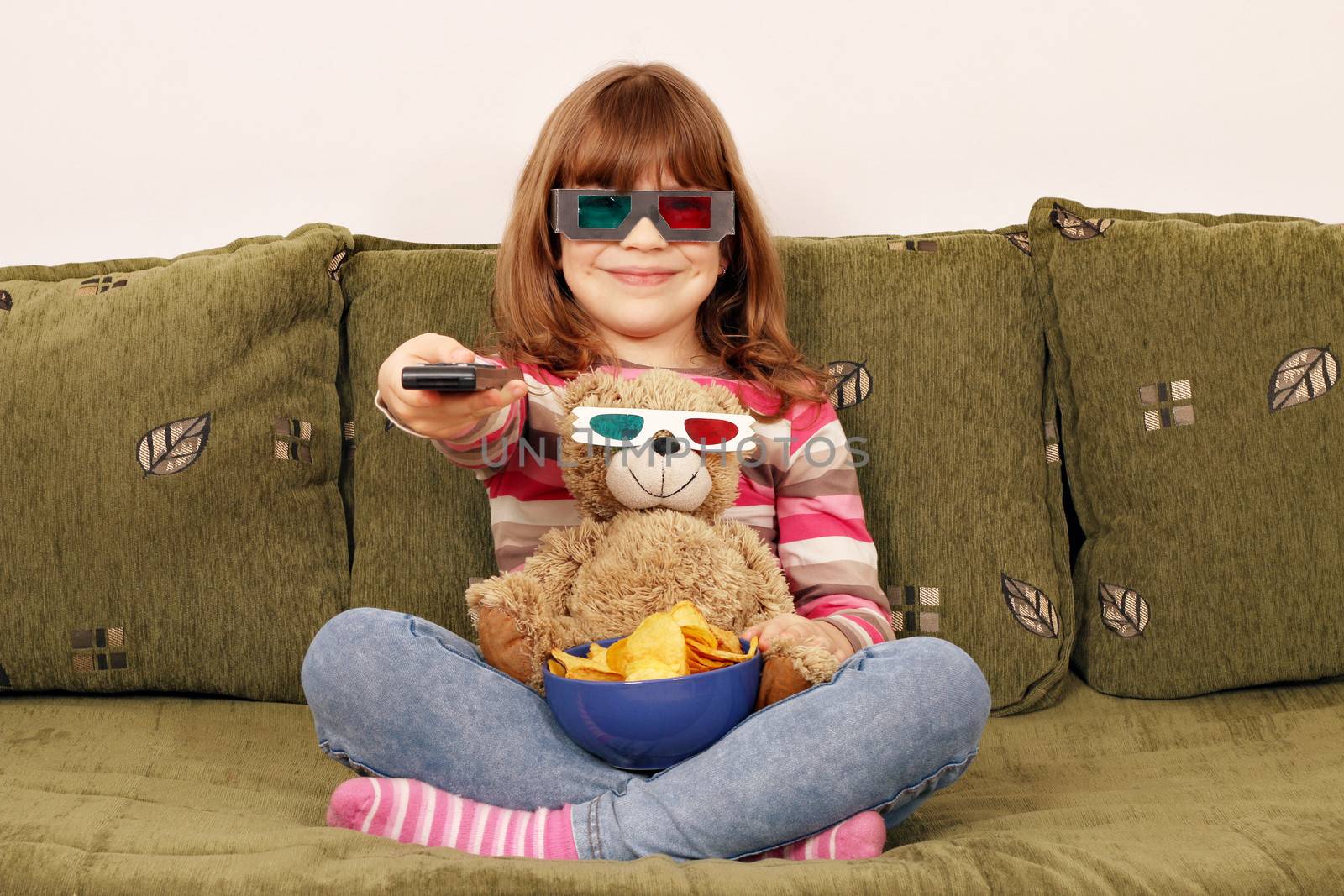 little girl and teddy bear with 3d glasses watching tv by goce