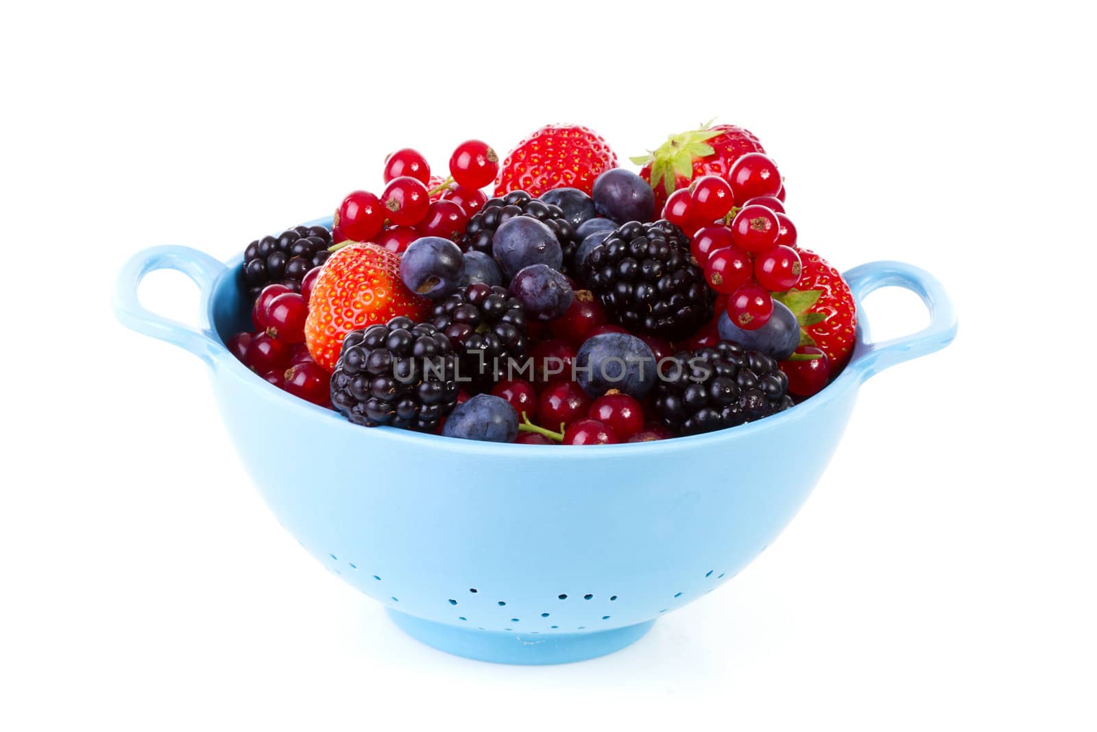 Blue colander with healthy fresh fruit over white background