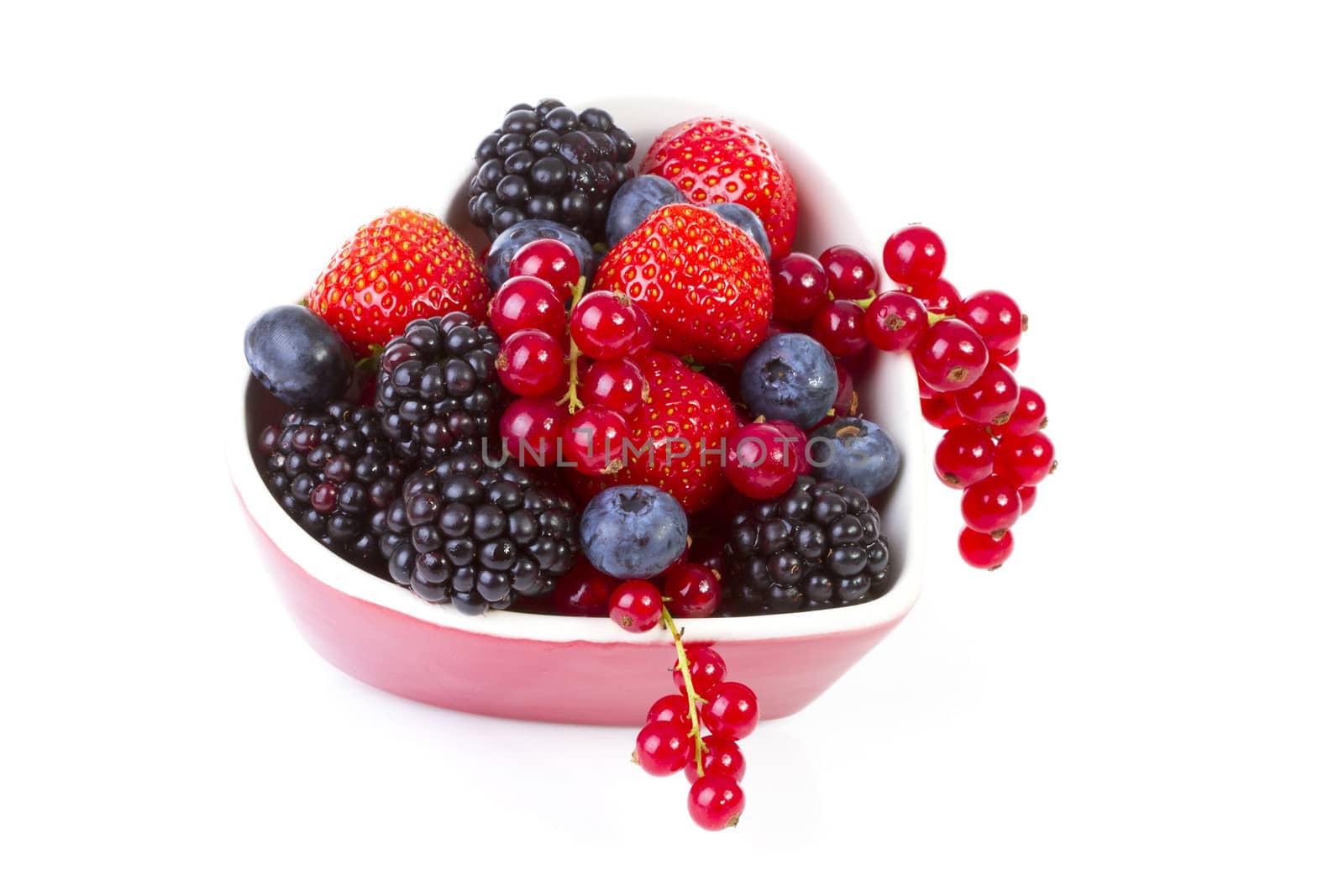 Bowl with fresh fruit over white background