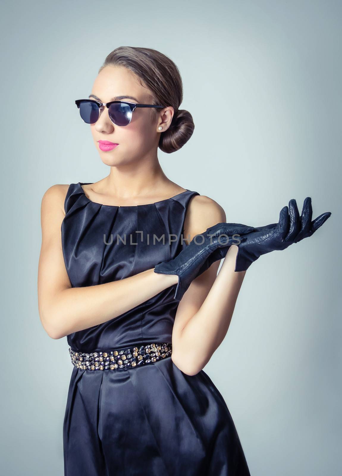 Fashion portrait of beautiful young girl with sunglasses in classic vintage style