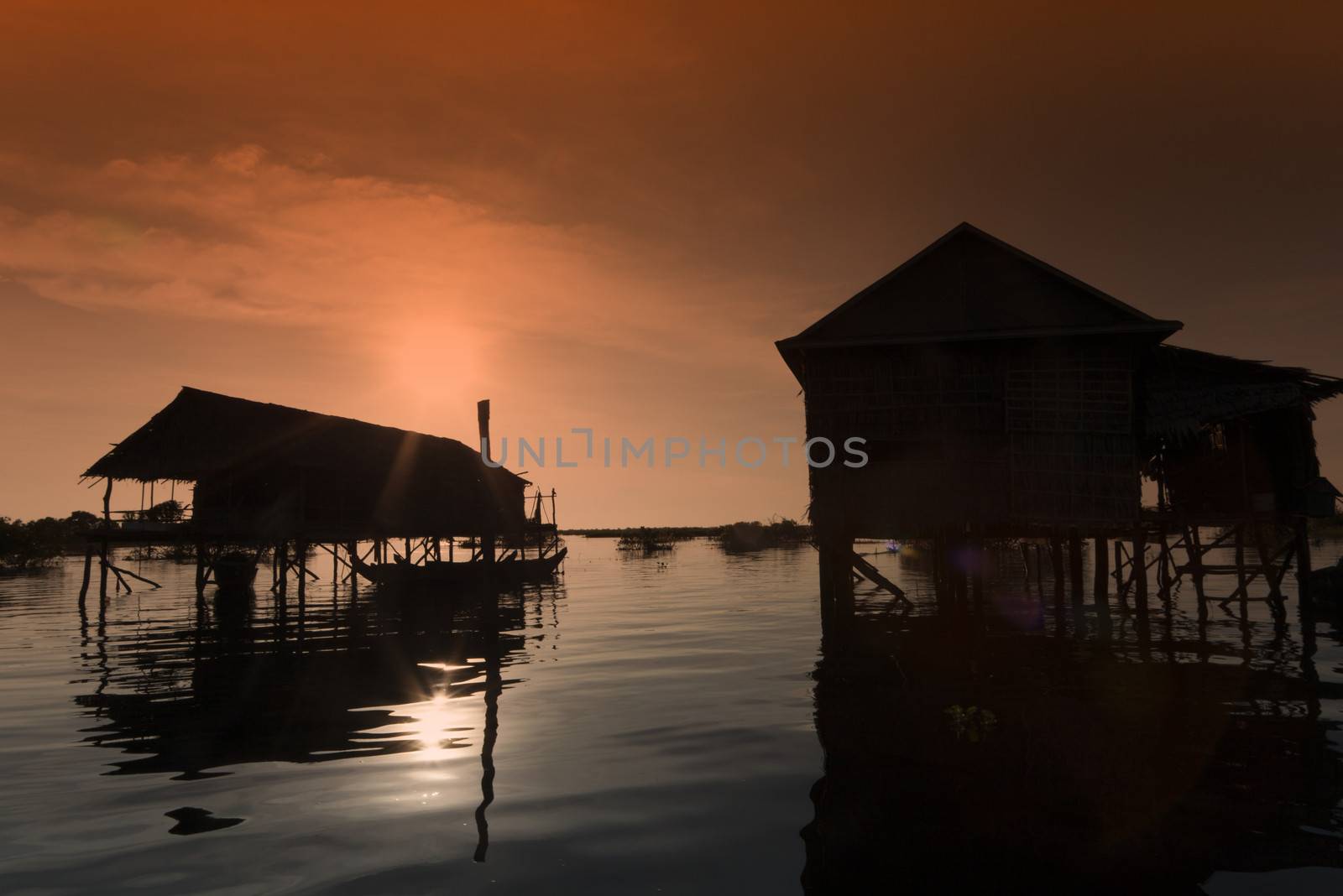 slilt houses in the evening at tonle sap lake in Cambodia