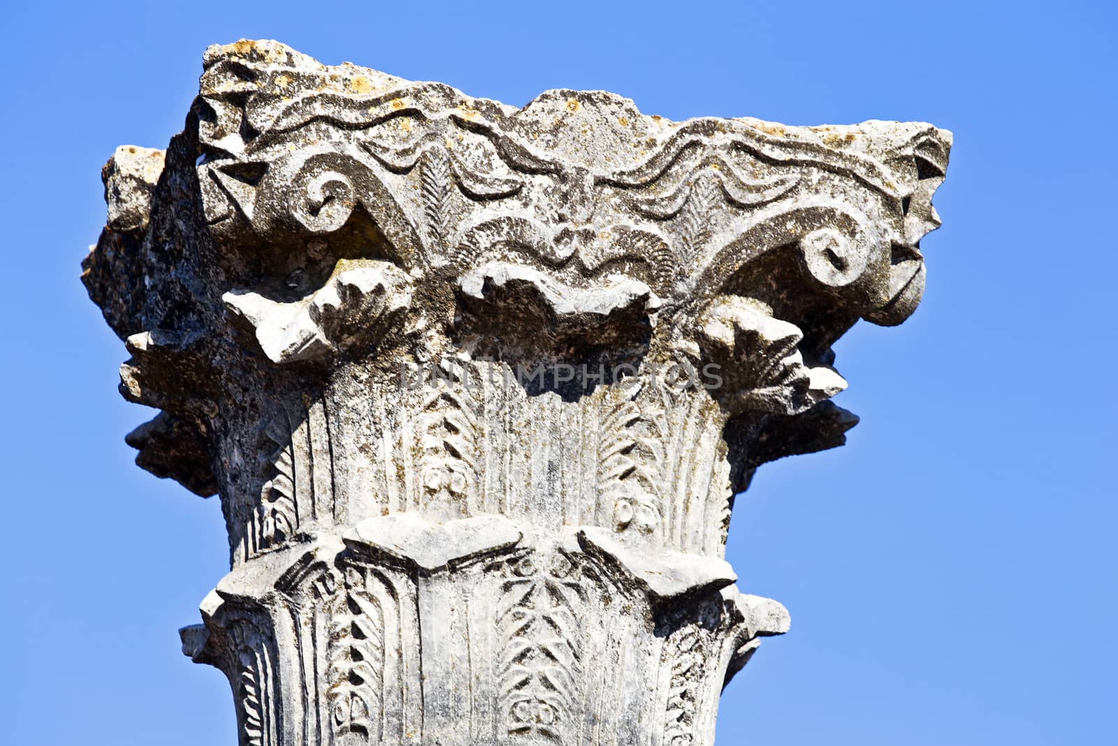 Old pillar close up at Volubilis in Morocco. Volubilis is a partly excavated Roman city in Morocco situated near Meknes between Fes and Rabat. It was developed from the 3rd century BC onwards as a Phoenician Carthaginian settlement