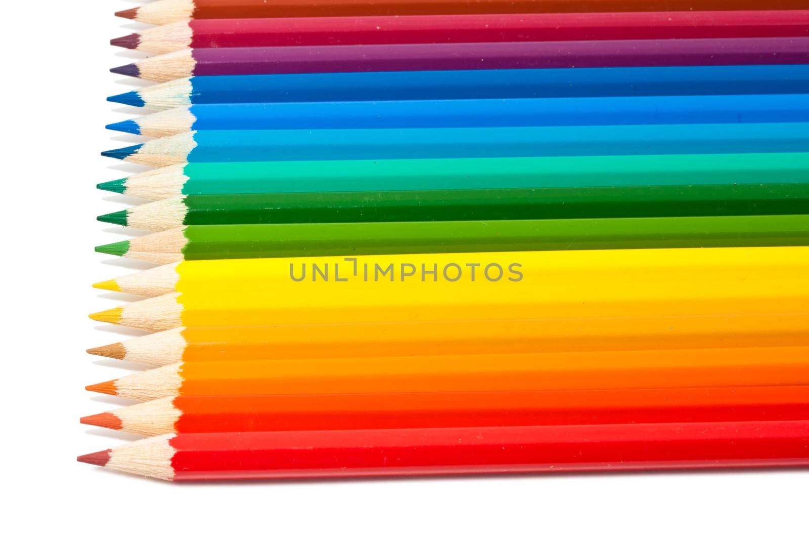 Close up photo of colour pencils isolated on white background