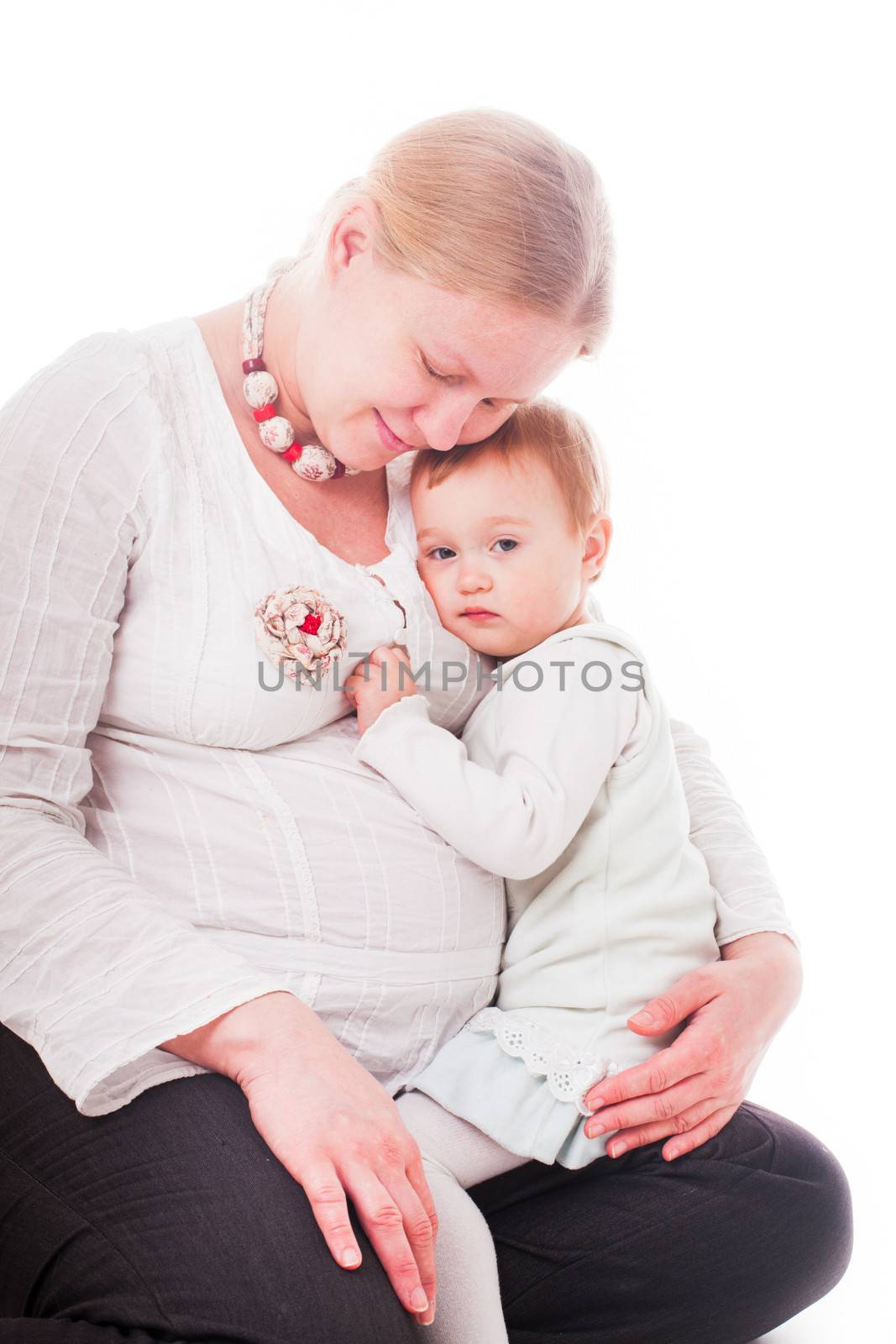 Pregnant woman with daughter close up isolated on white