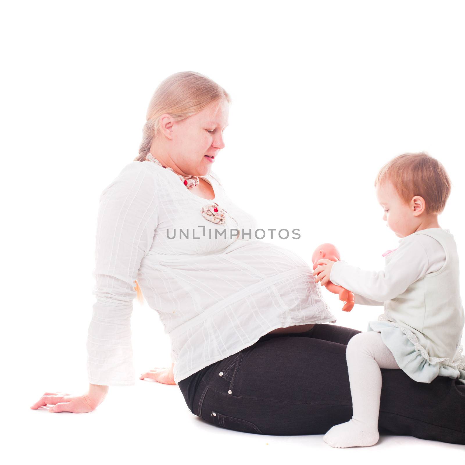 Pregnant woman with daughter and doll isolated on white