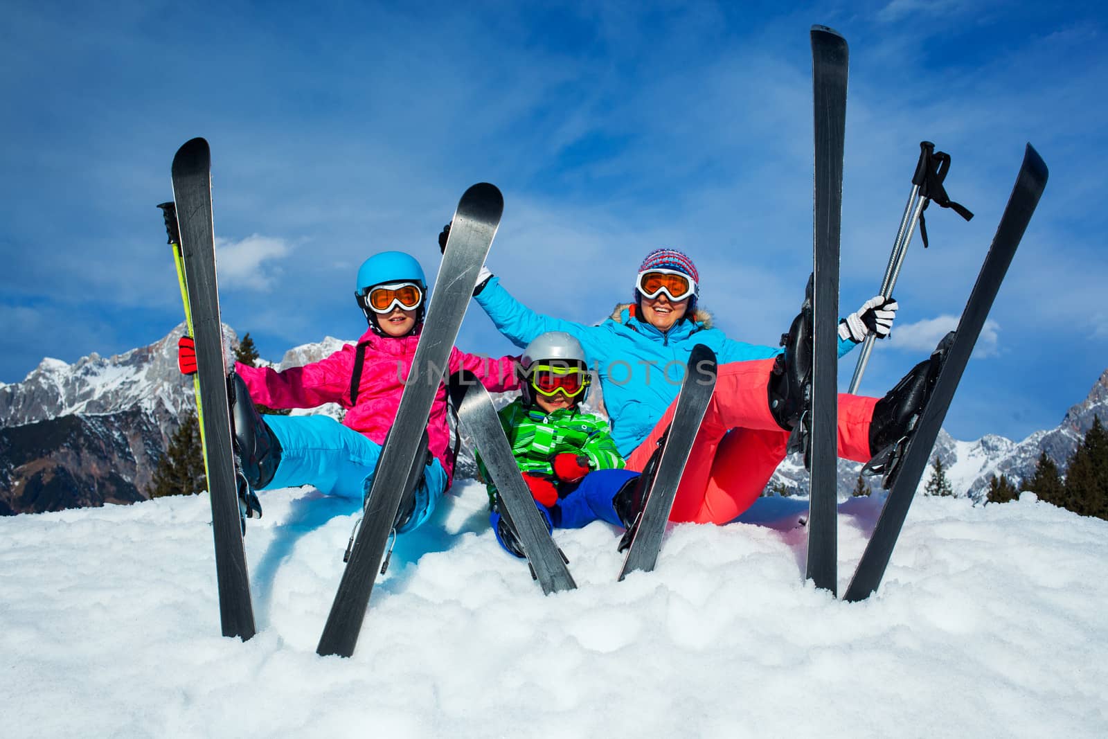 Ski, winter, snow, skiers, sun and fun - family enjoying winter vacations.