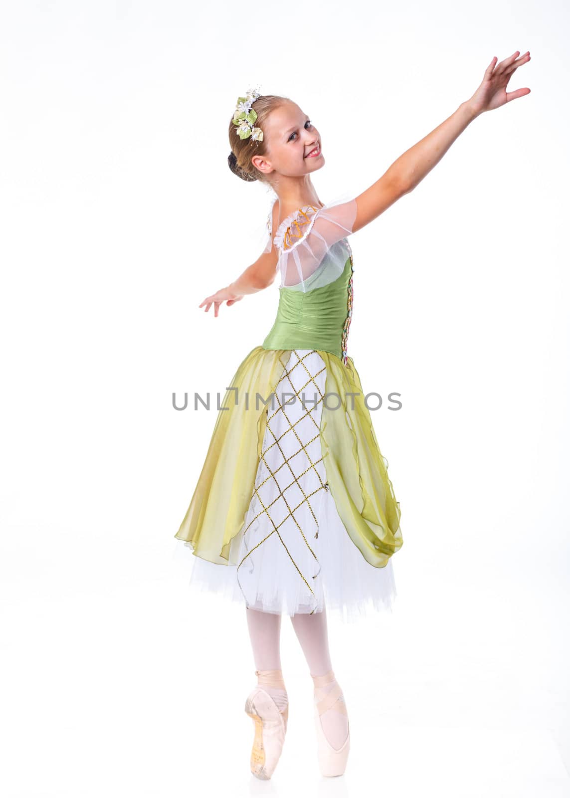 Beautiful young ballerina on a white background