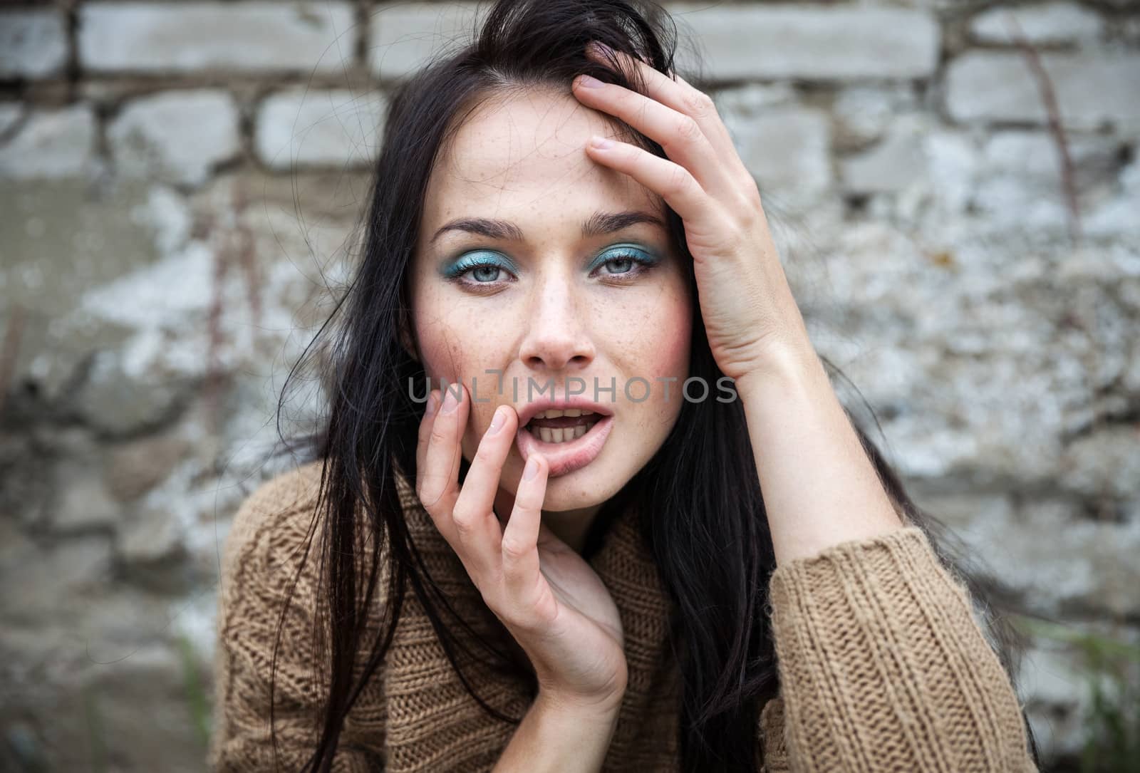 girl against old brick wall by palinchak