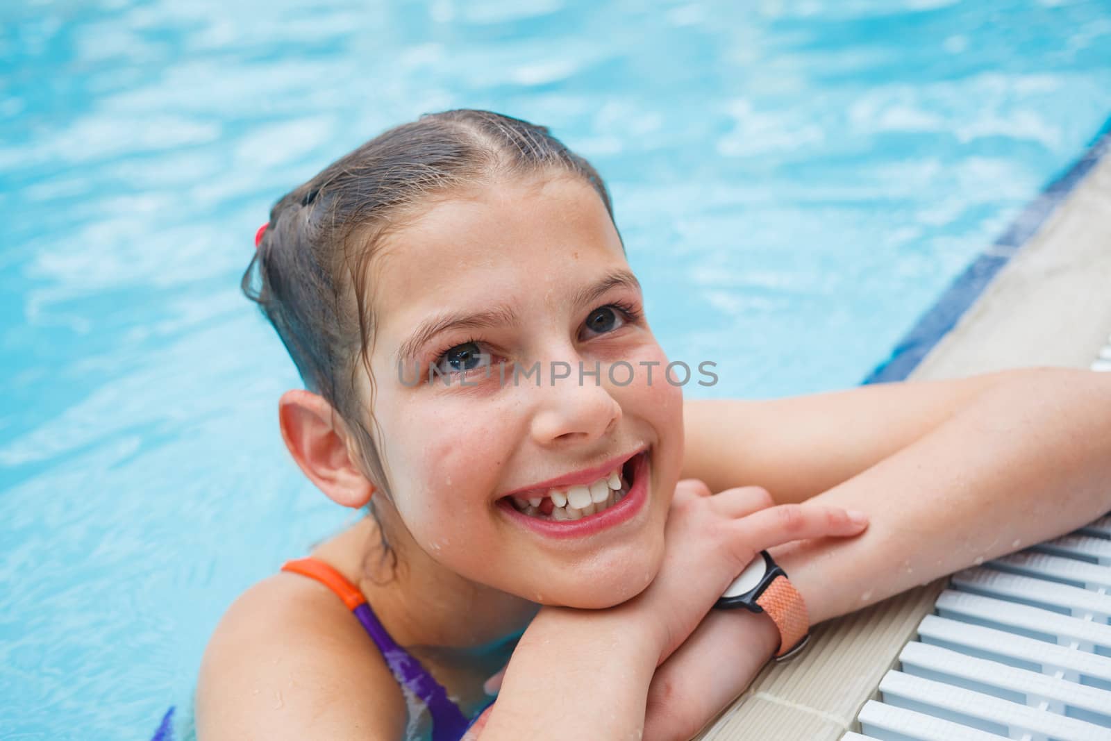 Activities on the pool. Cute girl in swimming pool