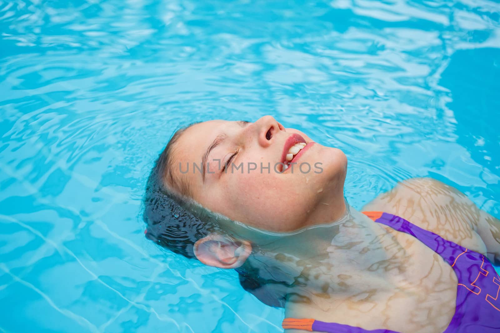 Activities on the pool. Cute girl in swimming pool