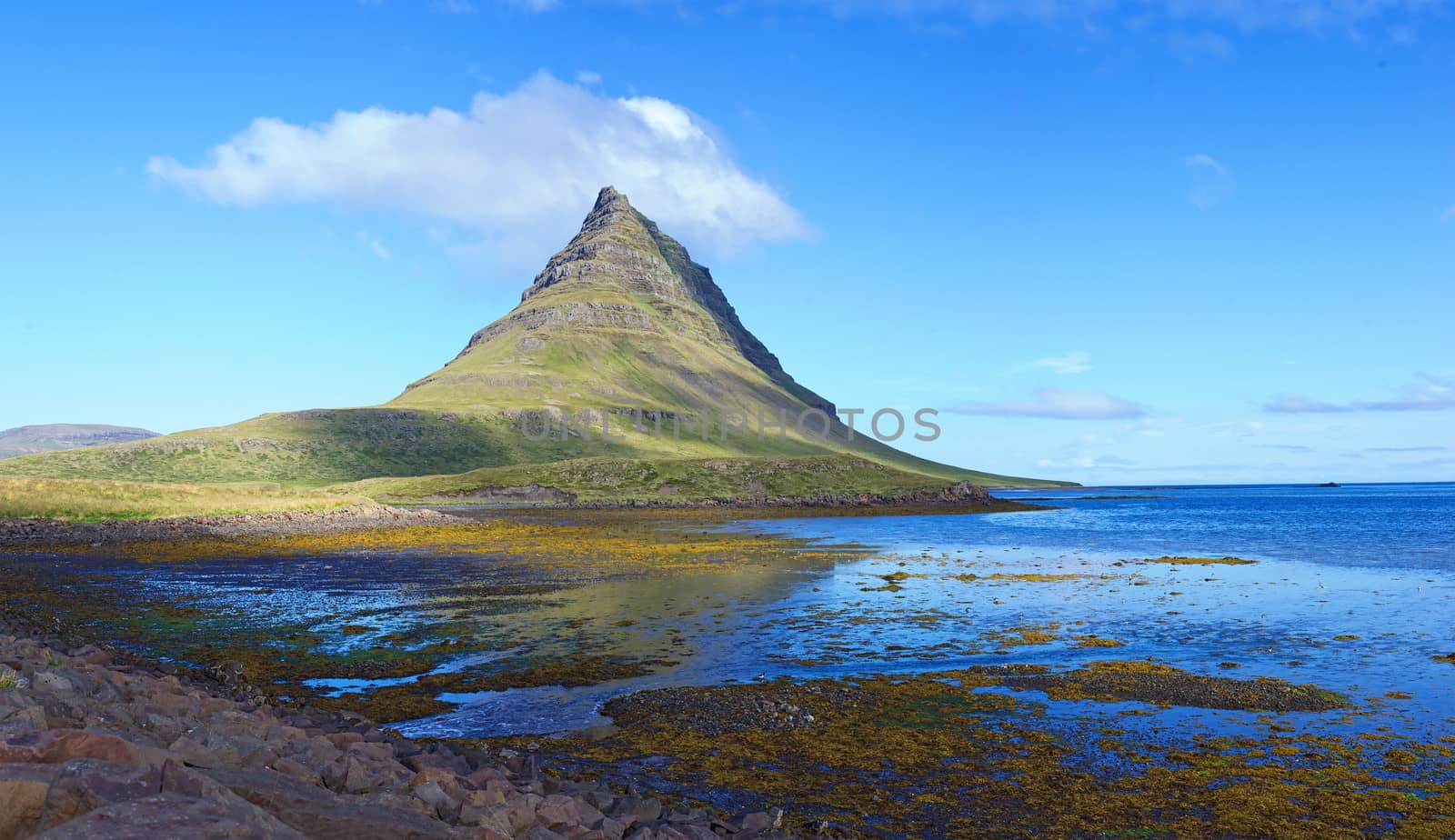 Mount Kirkjufell east face from the village of Grundarfjordur in the peninsula of Snaefellsnes, West Iceland.