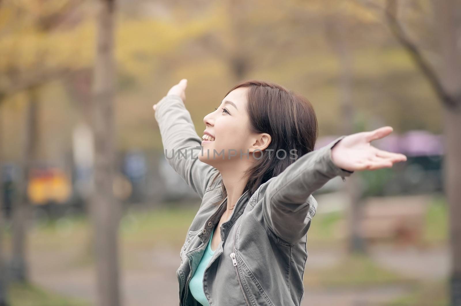 Asian beauty open arms and feel free in the city.