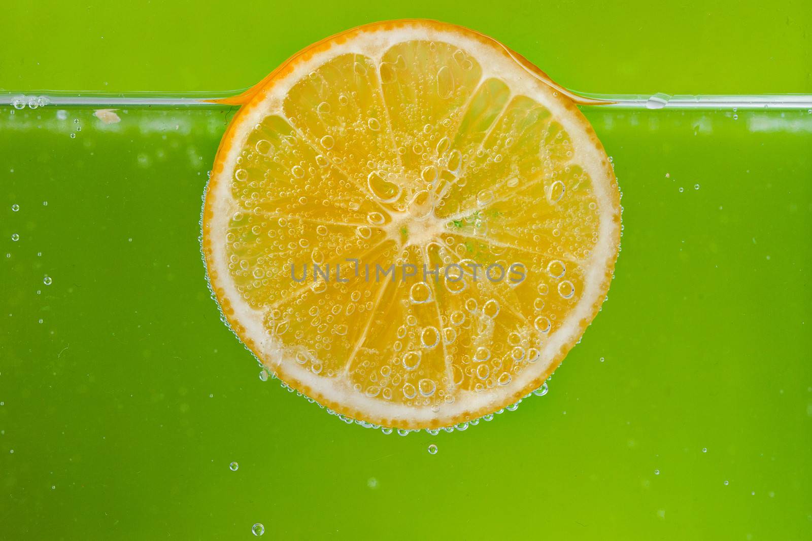 Glass citrus squeezer with lemons and juice