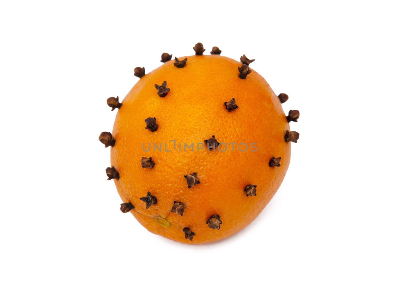 Orange studded cloves isolated on the white background