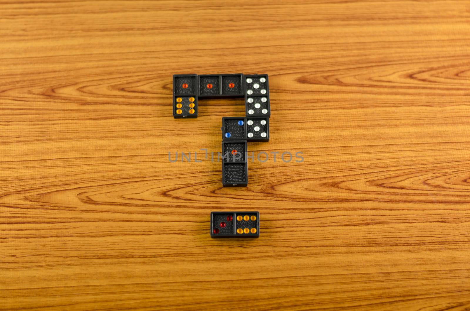 black domino on wooden background