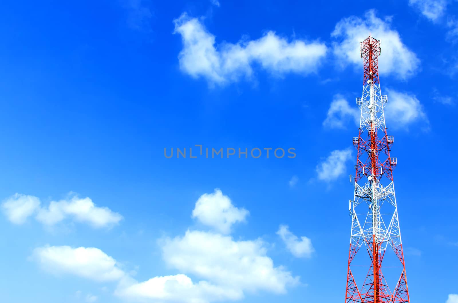communication antennas, radio telephone mobile phone antennas on blue sky