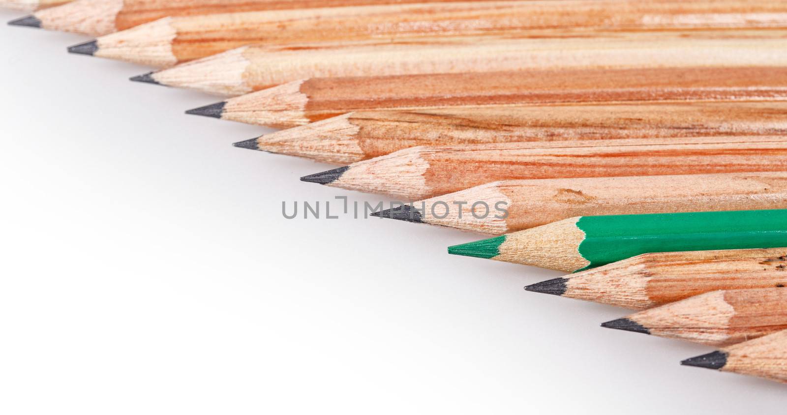 Color pencil stands out against a series of graphite pencils