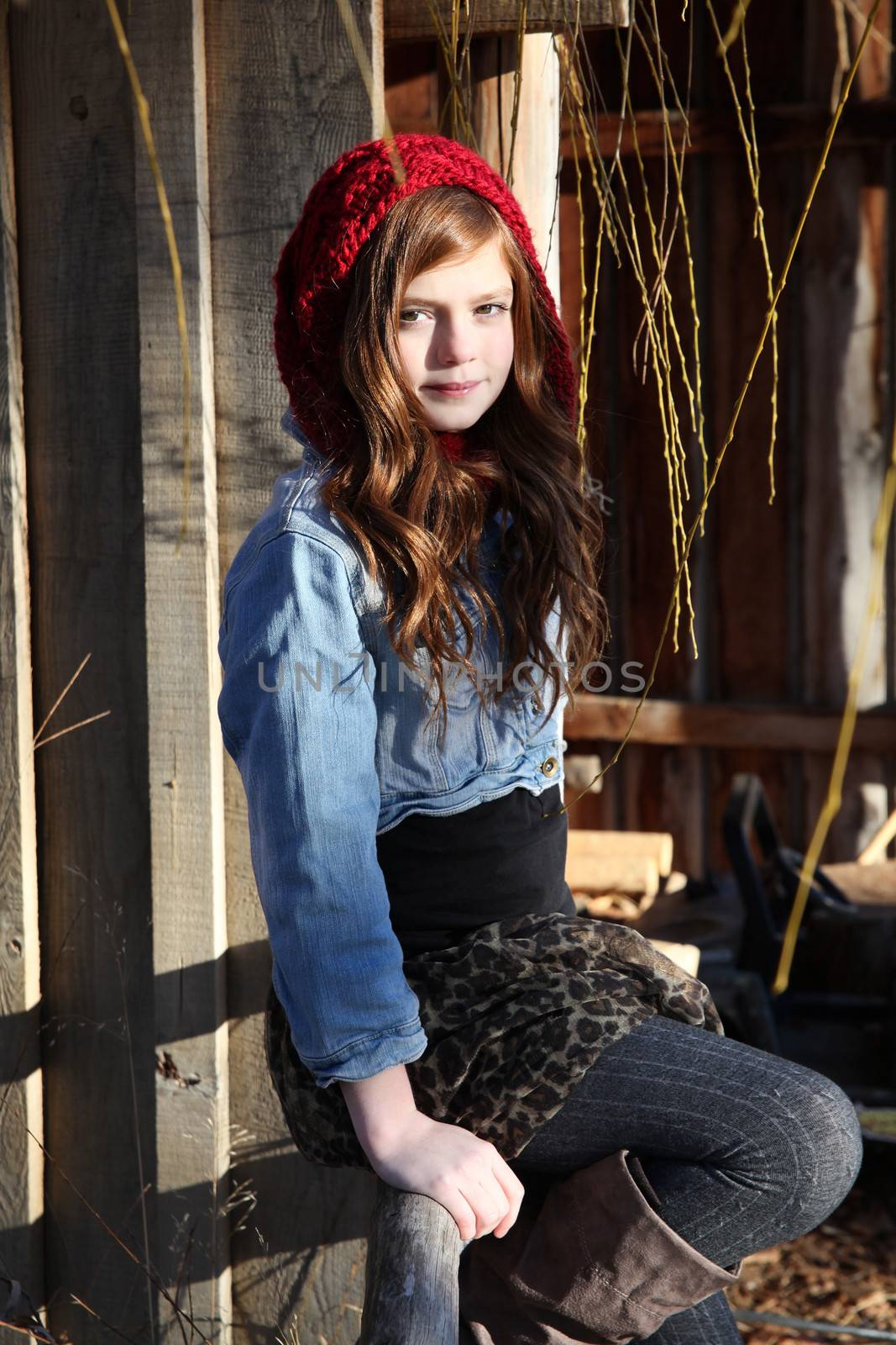 Teen winter girl wearing a red hat 