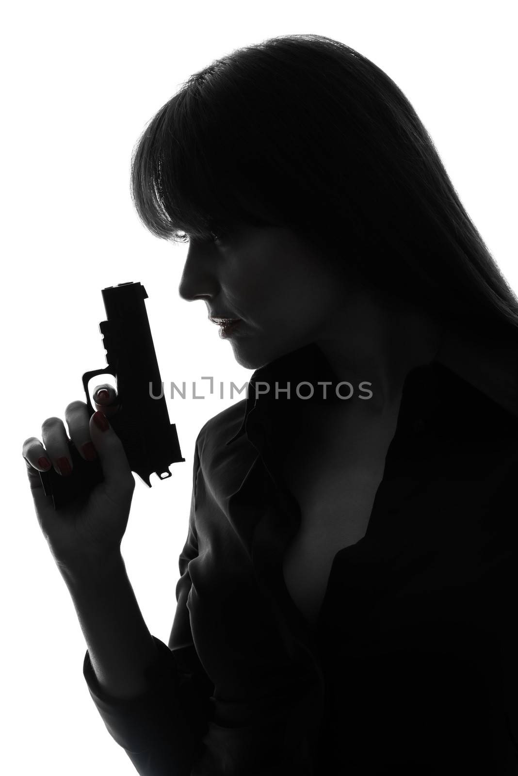 one caucasian sexy detective woman holding gun in silhouette studio isolated on white background