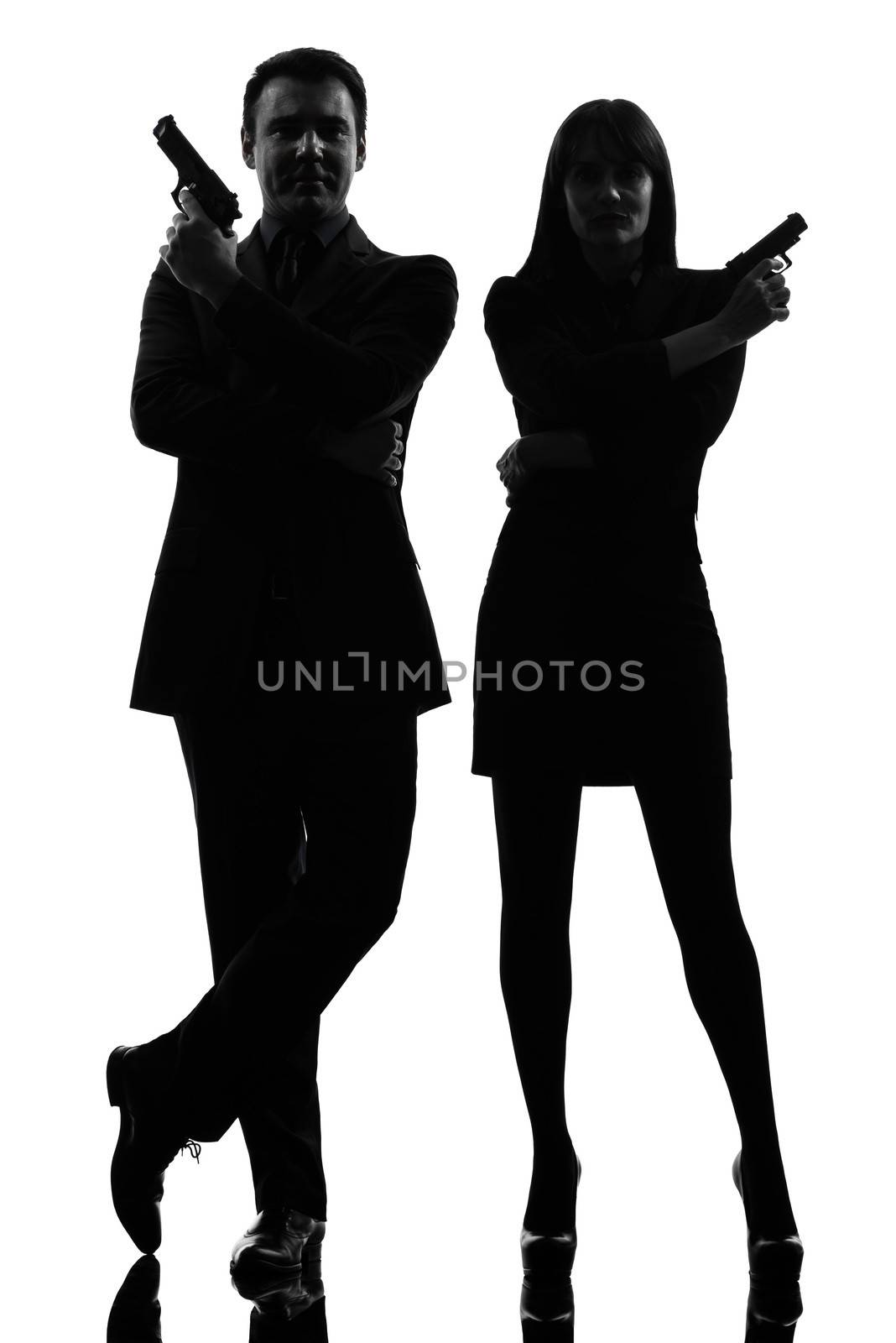 one caucasian man detective secret agent criminal with gun in silhouette studio isolated on white background