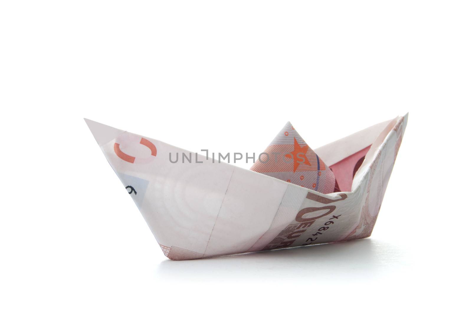 Paper boat made from Euro banknotes over a white background 