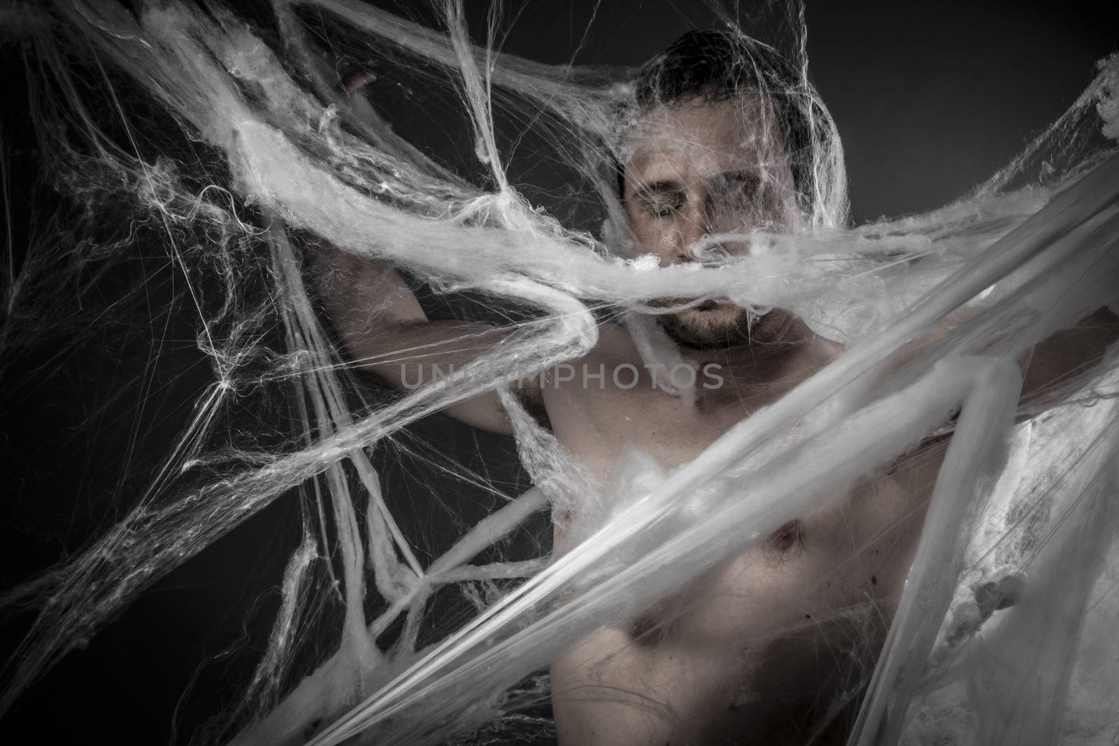 Geometry.man tangled in huge white spider web by FernandoCortes