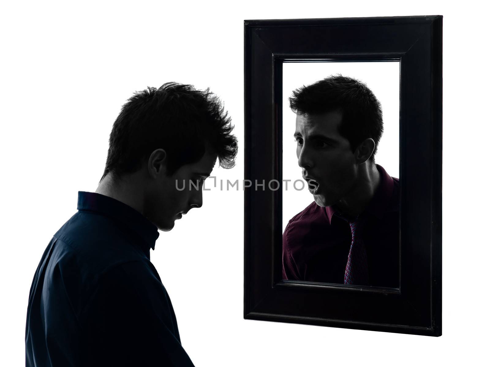 man in front of his mirror in shadow white background