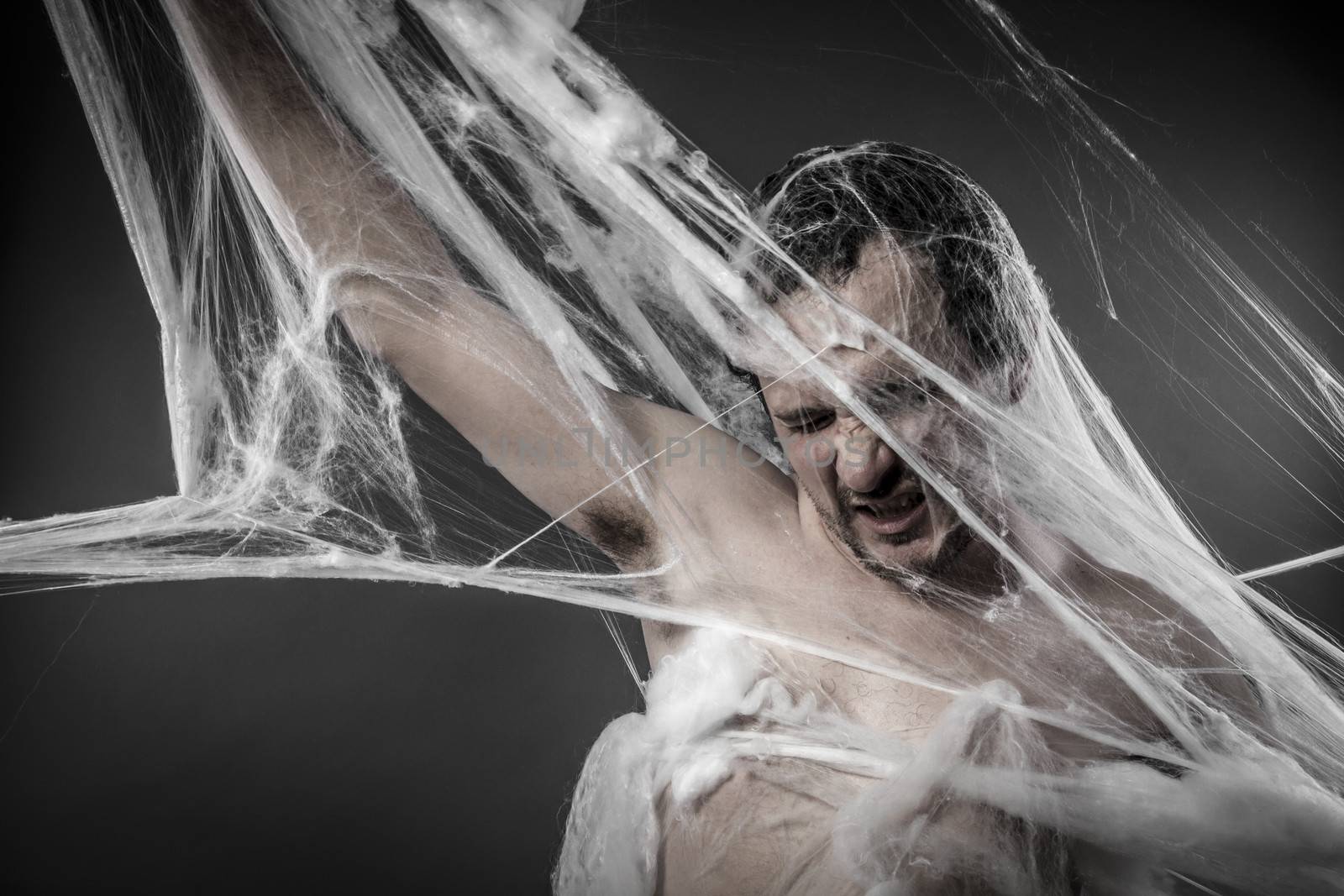 Arachnid.man tangled in huge white spider web by FernandoCortes
