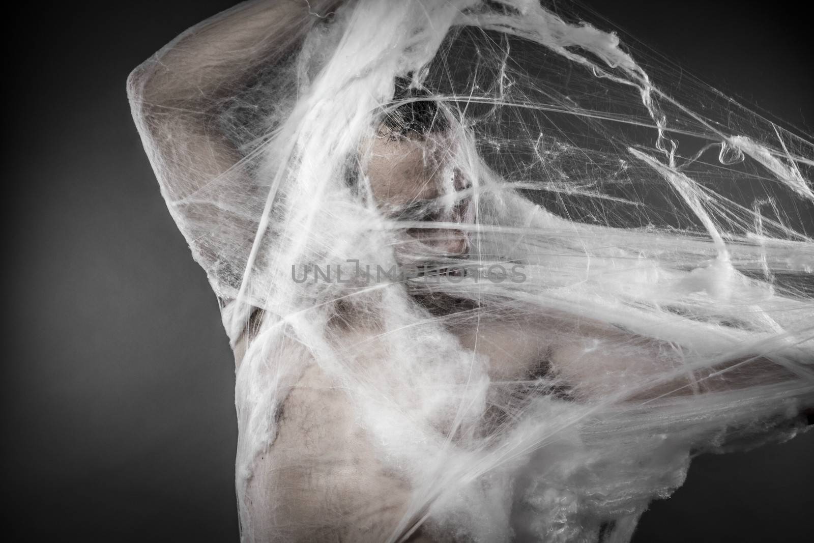 Trap.man tangled in huge white spider web by FernandoCortes