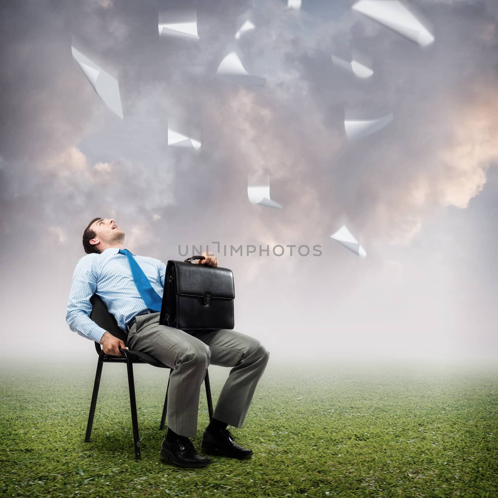 image of a business man looking at the falling paper