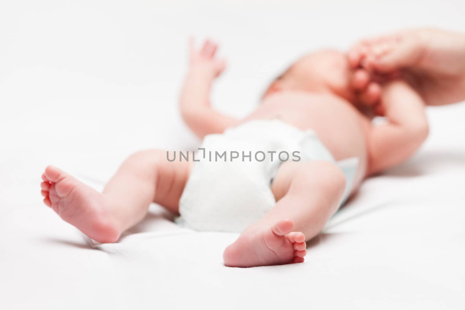 Cute sleeping newborn baby child holding mother hand by ia_64