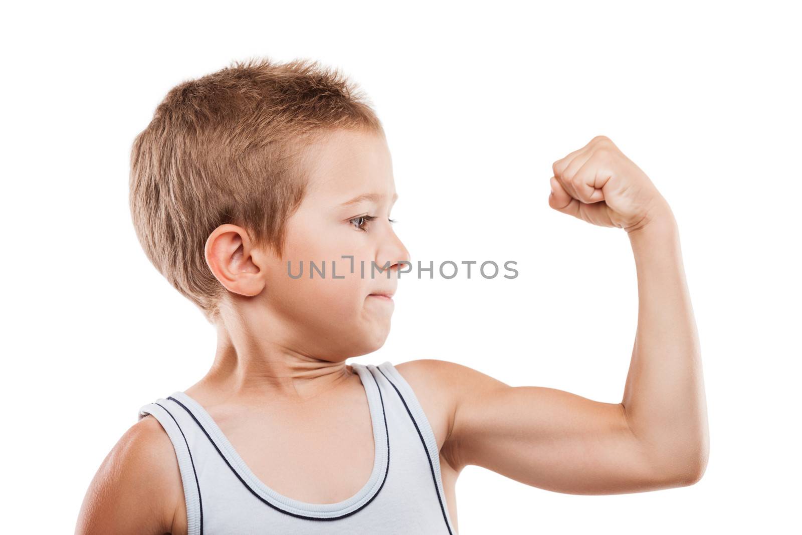 Smiling sport child boy showing hand biceps muscles strength by ia_64