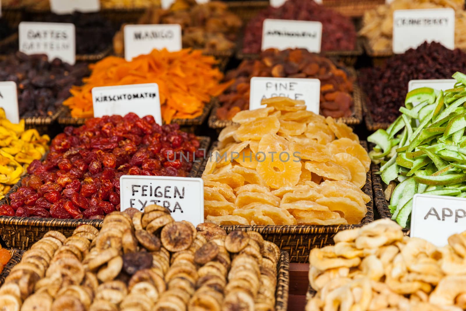 Healthy eating dried fruit snack at food market by ia_64