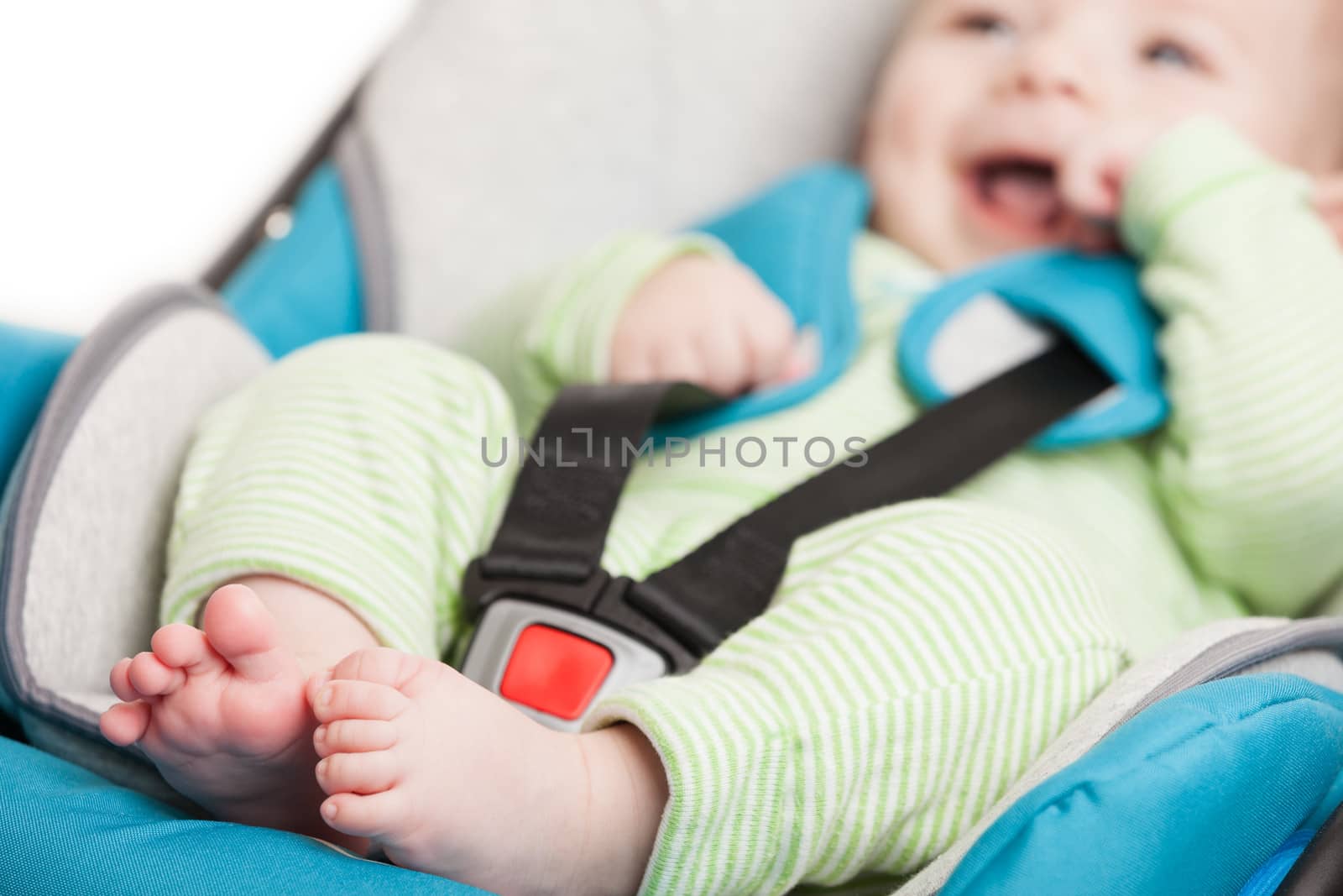 Little baby child in safety car seat by ia_64