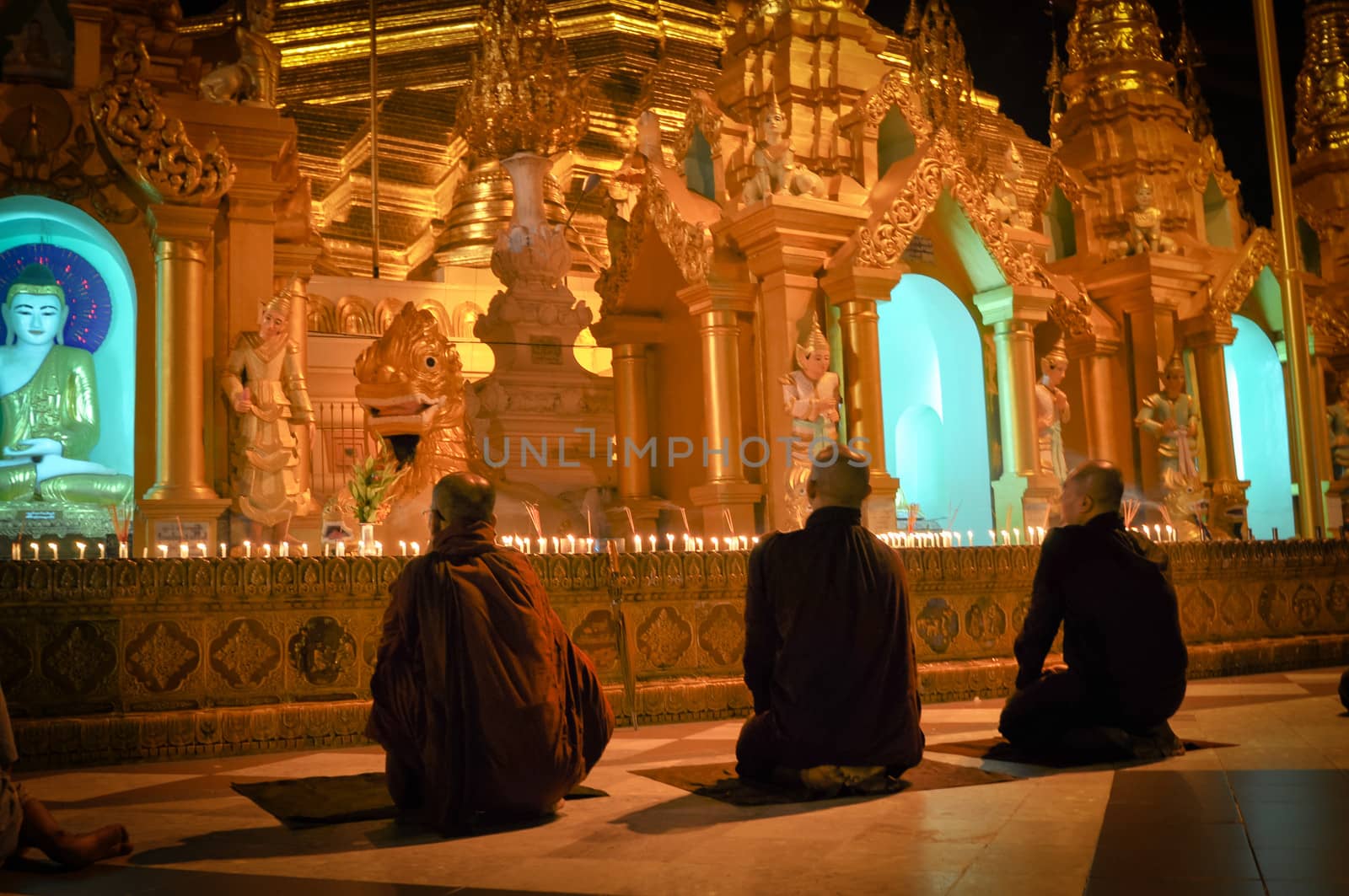 Three Monks Shwedagon Pagoda in Yangon City, Burma with Beautiful Evening Light: the beautiful golden pagoda, the oldest historical pagoda in Burma and the world, in the evening with great evening light.