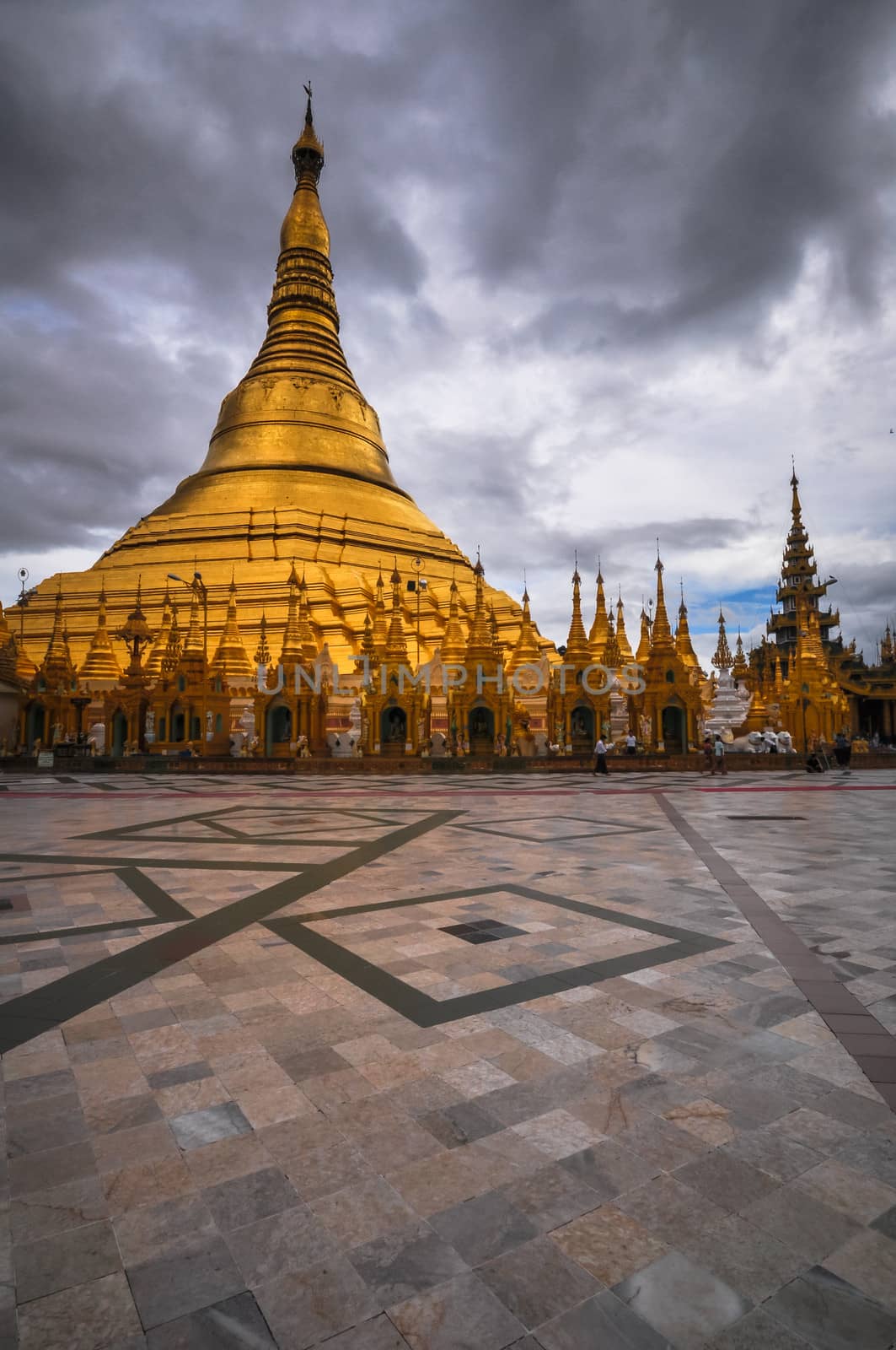Shwedagon Pagoda Temple shining in the beautiful sunset in Yango by weltreisendertj